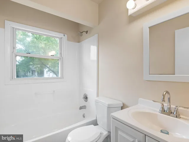 a bathroom with a sink toilet and a bathtub