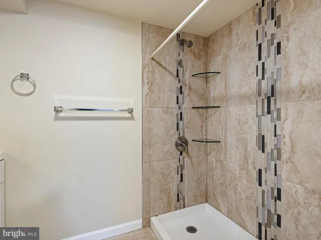 a bathroom with a shower and a toilet