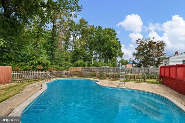a view of a swimming pool with a patio