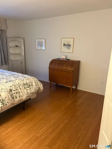 a bedroom with a bed and a table in it