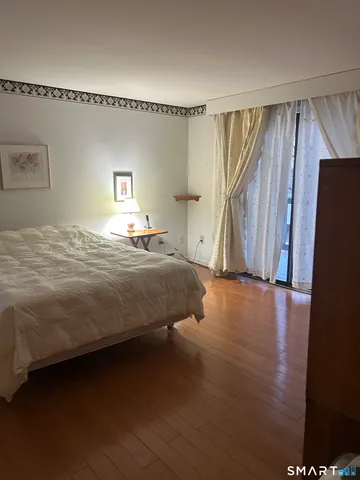 a bedroom with a bed and a table