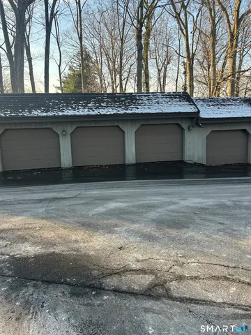 a house that has a tree in front of it