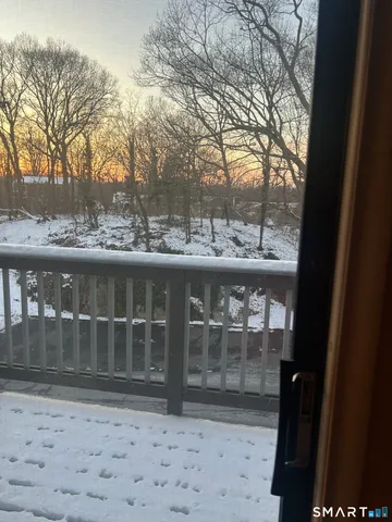 a view of a glass door and a yard