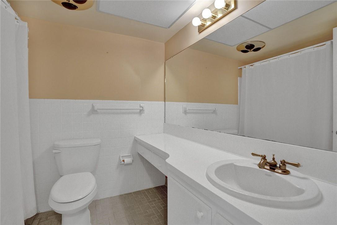 801 North Riverside Drive, Unit 7B Pompano Beach, FL 33062 - Photo 11 of 26 a bathroom with a sink and a toilet