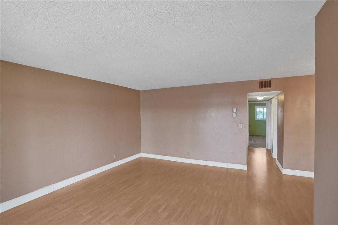 801 North Riverside Drive, Unit 7B Pompano Beach, FL 33062 - Photo 15 of 26 a view of an empty room with wooden floor