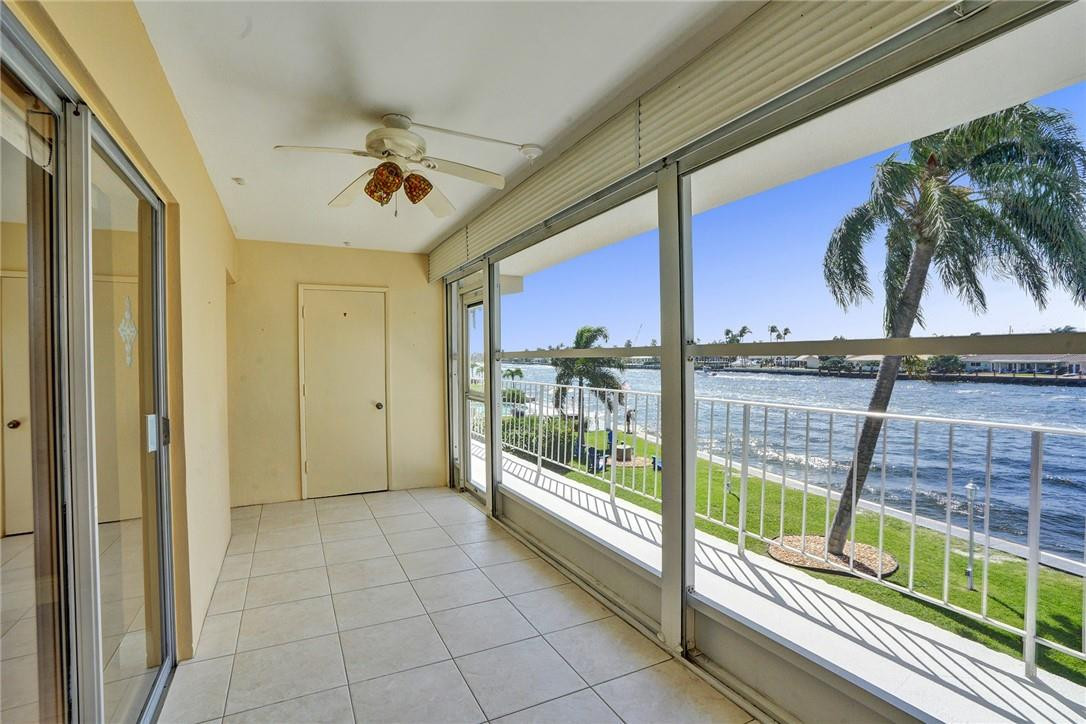 801 North Riverside Drive, Unit 7B Pompano Beach, FL 33062 - Photo 18 of 26 a view of a porch with furniture