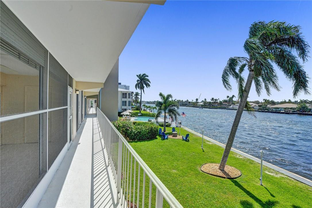 801 North Riverside Drive, Unit 7B Pompano Beach, FL 33062 - Photo 19 of 26 a view of a swimming pool with a deck
