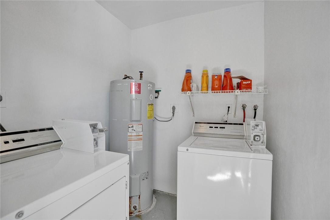 801 North Riverside Drive, Unit 7B Pompano Beach, FL 33062 - Photo 21 of 26 a utility room with dryer and washer