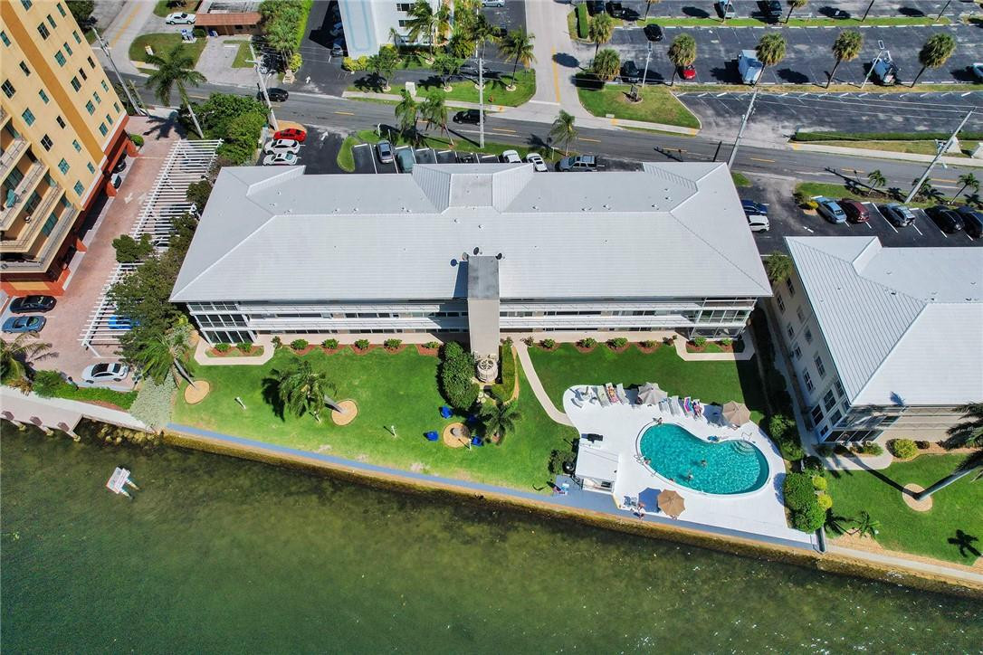 801 North Riverside Drive, Unit 7B Pompano Beach, FL 33062 - Photo 3 of 26 an aerial view of a tennis ground with large trees