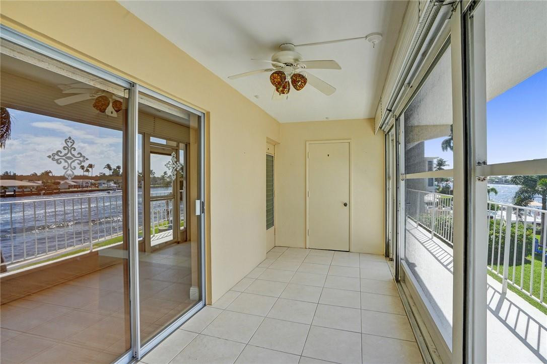 801 North Riverside Drive, Unit 7B Pompano Beach, FL 33062 - Photo 8 of 26 a view of a hallway with a door