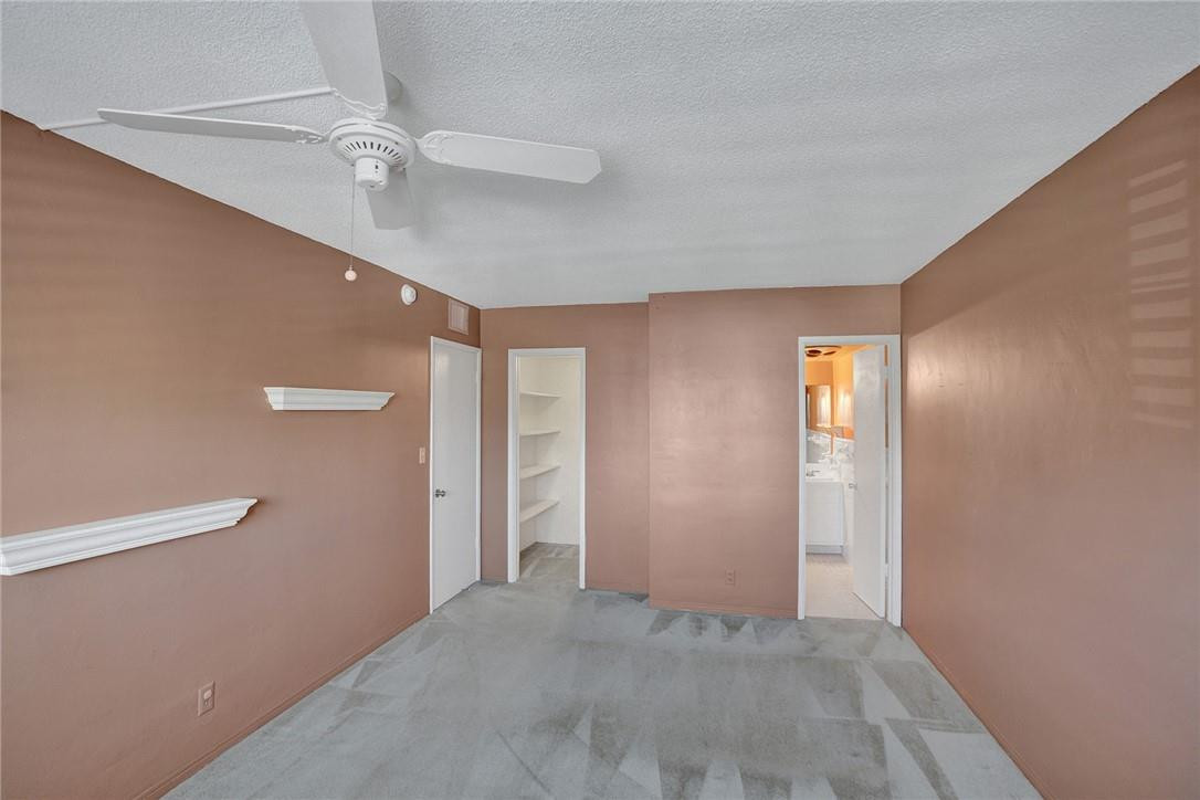 801 North Riverside Drive, Unit 7B Pompano Beach, FL 33062 - Photo 10 of 26 wooden floor in an empty room with a window