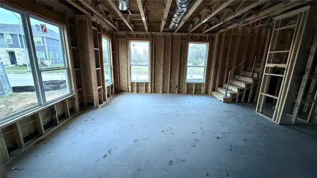 a view of an empty room with windows