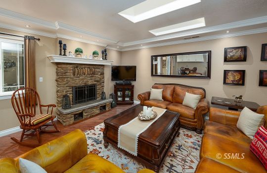 413 South Valley Street Ridgecrest, CA 93555 - Photo 6 of 40 a living room with furniture and a fireplace