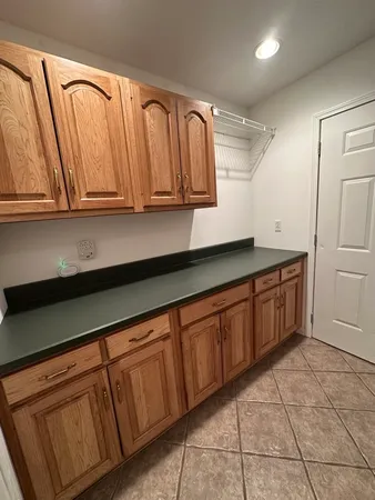 a kitchen with stainless steel appliances granite countertop a sink and cabinets