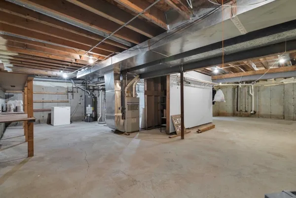 a view of empty room with wooden walls