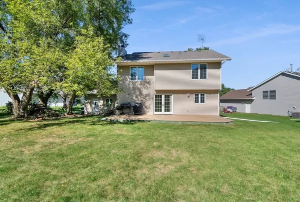 a view of a house with a yard