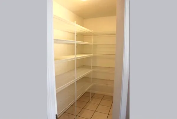 a bathroom with a glass shower door