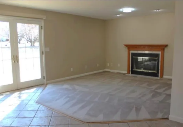 a view of an empty room and window