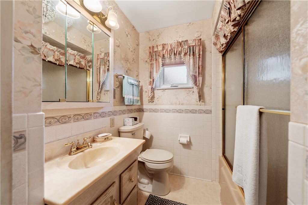 25 Willow Drive Monessen, PA 15062 - Photo 19 of 33 a bathroom with a sink toilet and shower