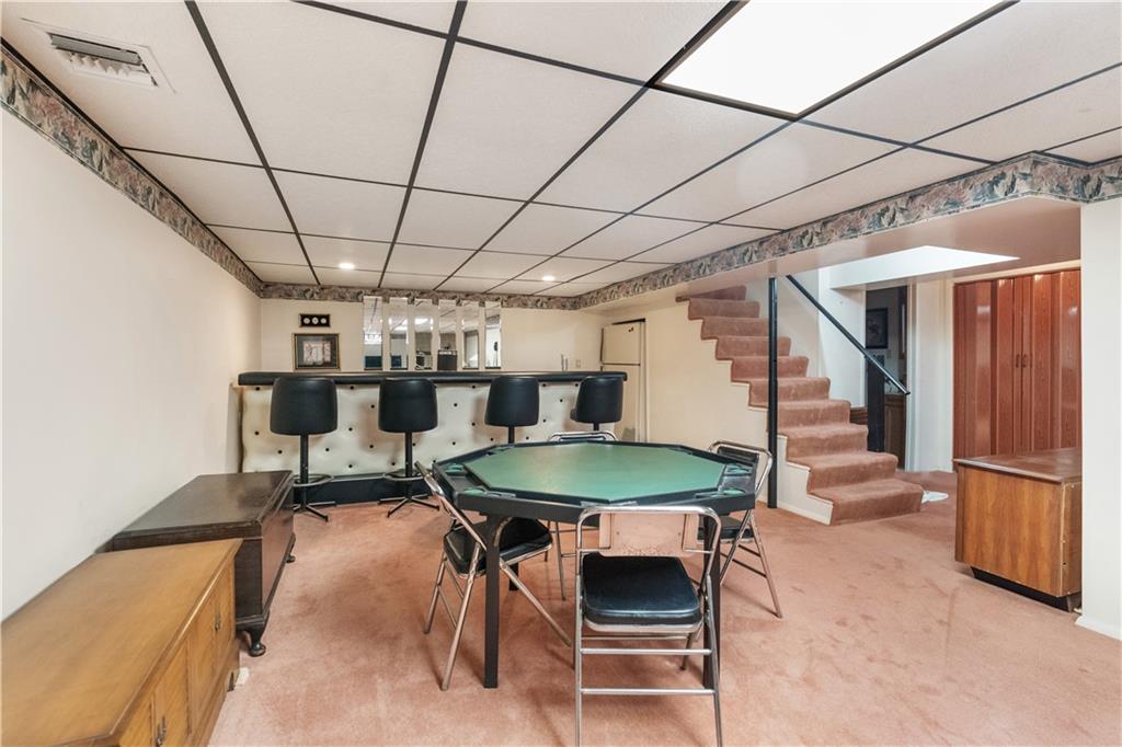 25 Willow Drive Monessen, PA 15062 - Photo 21 of 33 a room with furniture and a kitchen