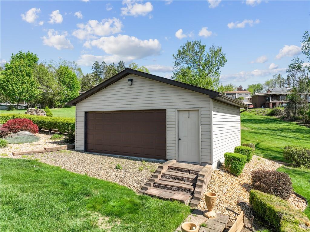 25 Willow Drive Monessen, PA 15062 - Photo 26 of 33 a front view of house with yard and trees in the background