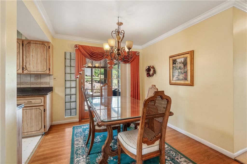 25 Willow Drive Monessen, PA 15062 - Photo 4 of 33 a dining room with furniture a chandelier and wooden floor