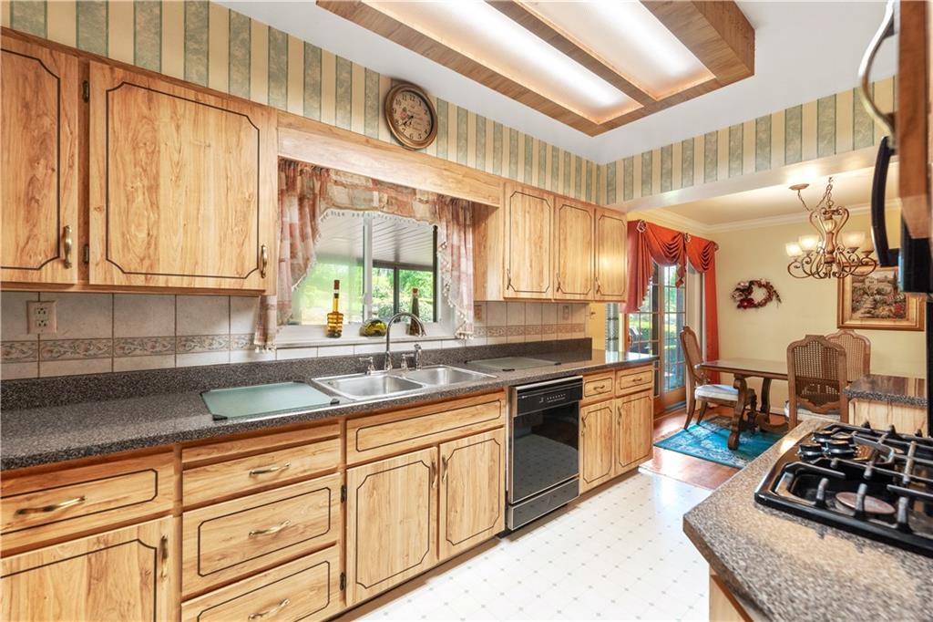 25 Willow Drive Monessen, PA 15062 - Photo 6 of 33 a kitchen with stainless steel appliances granite countertop a sink stove and cabinets