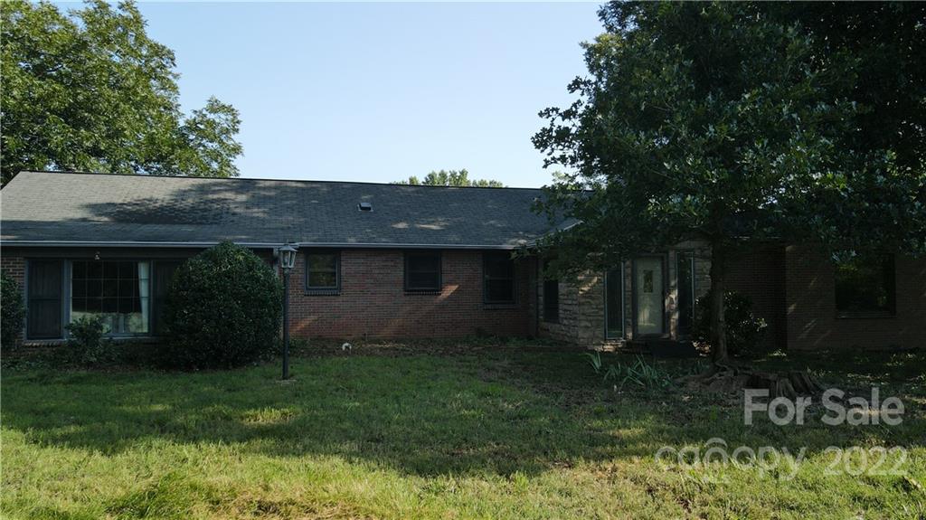 9030 Potter Road Lancaster, SC 29720 - Photo 13 of 26 a view of a backyard with plants and large trees