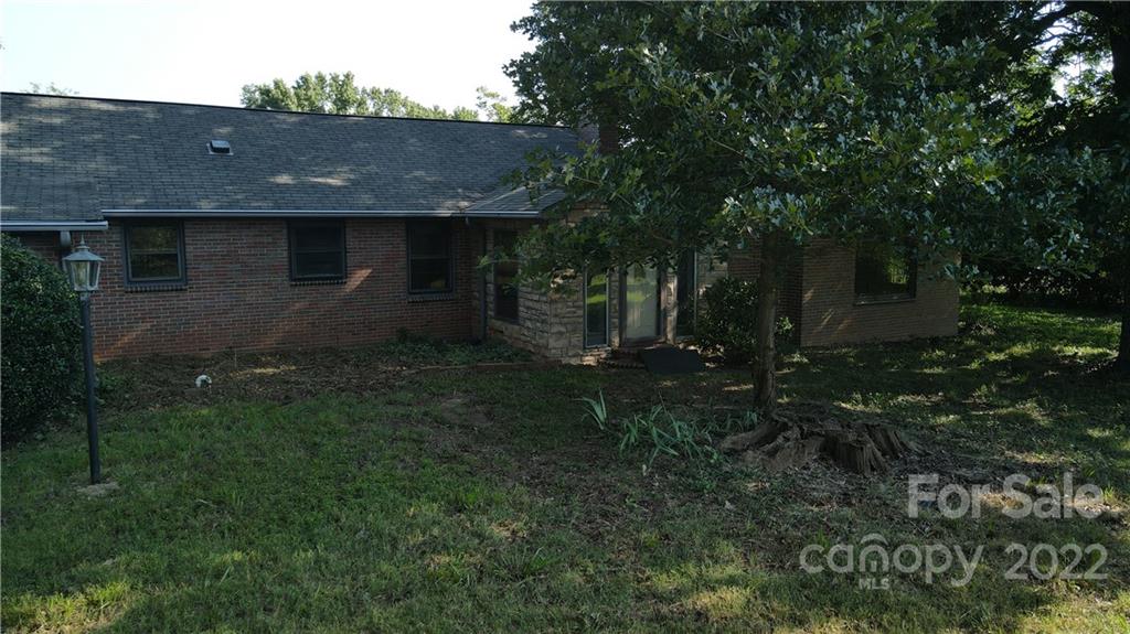 9030 Potter Road Lancaster, SC 29720 - Photo 14 of 26 a view of a barn in the middle of a yard