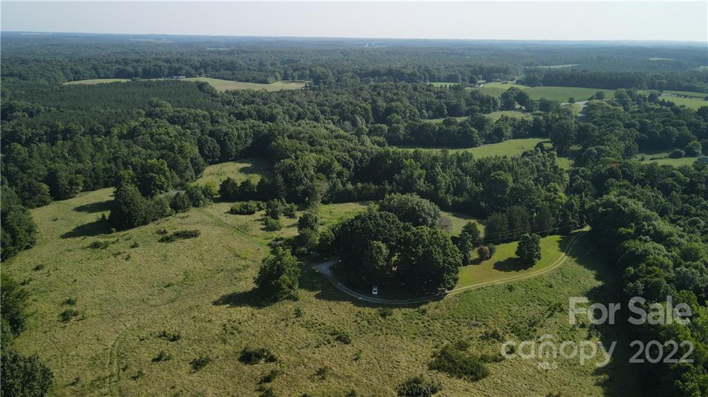 9030 Potter Road Lancaster, SC 29720 - Photo 18 of 26 a view of a forest with a yard