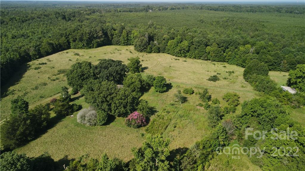 9030 Potter Road Lancaster, SC 29720 - Photo 3 of 26 a view of a backyard of the house