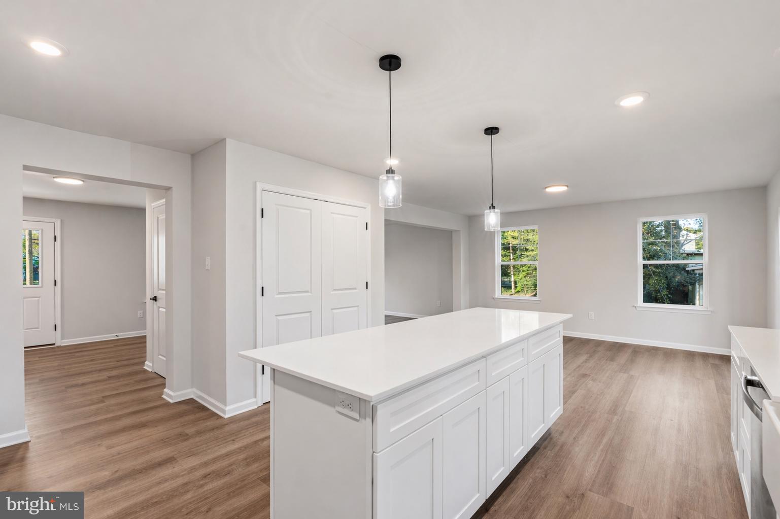 212 Lotus Avenue Voorhees, NJ 08043 - Photo 11 of 39 a living room with hard wood flooring and white walls