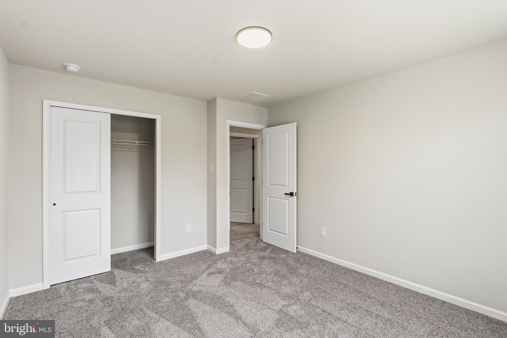 212 Lotus Avenue Voorhees, NJ 08043 - Photo 22 of 39 an empty room with fan and entrance