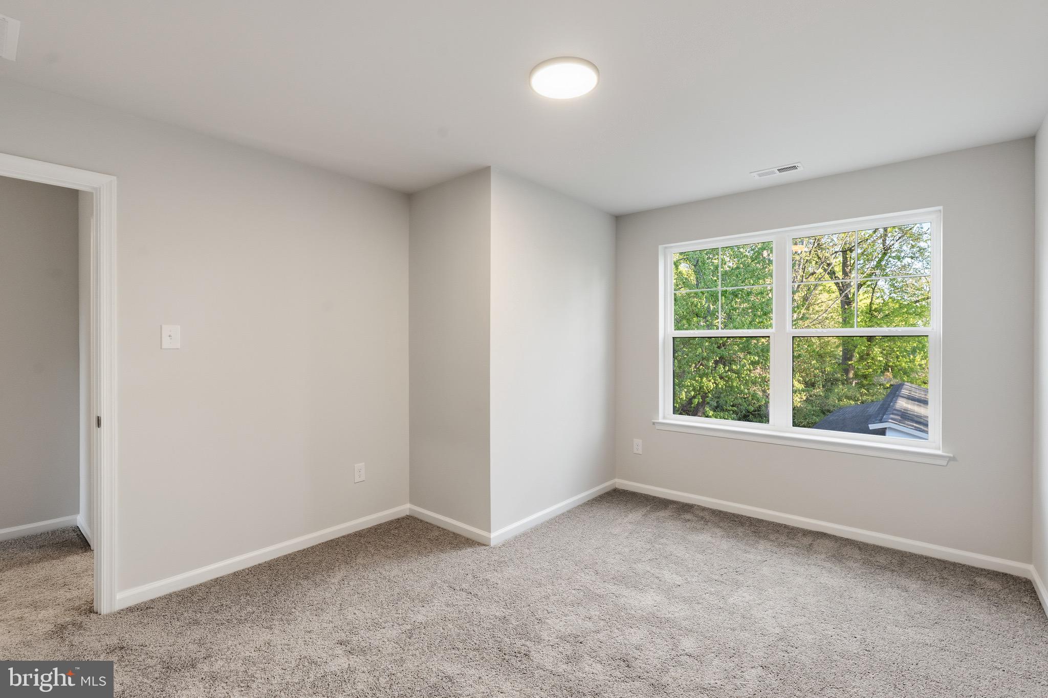 212 Lotus Avenue Voorhees, NJ 08043 - Photo 23 of 39 an empty room with windows