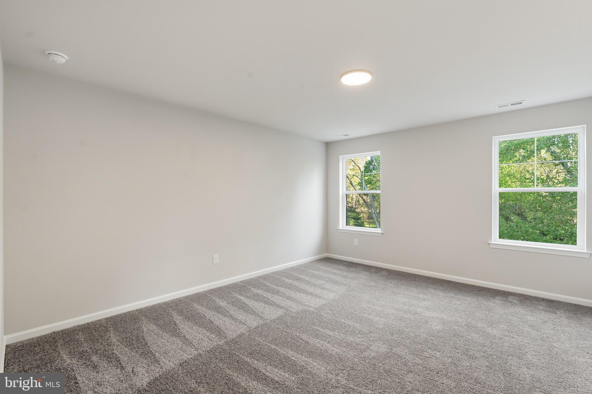 212 Lotus Avenue Voorhees, NJ 08043 - Photo 27 of 39 an empty room with windows