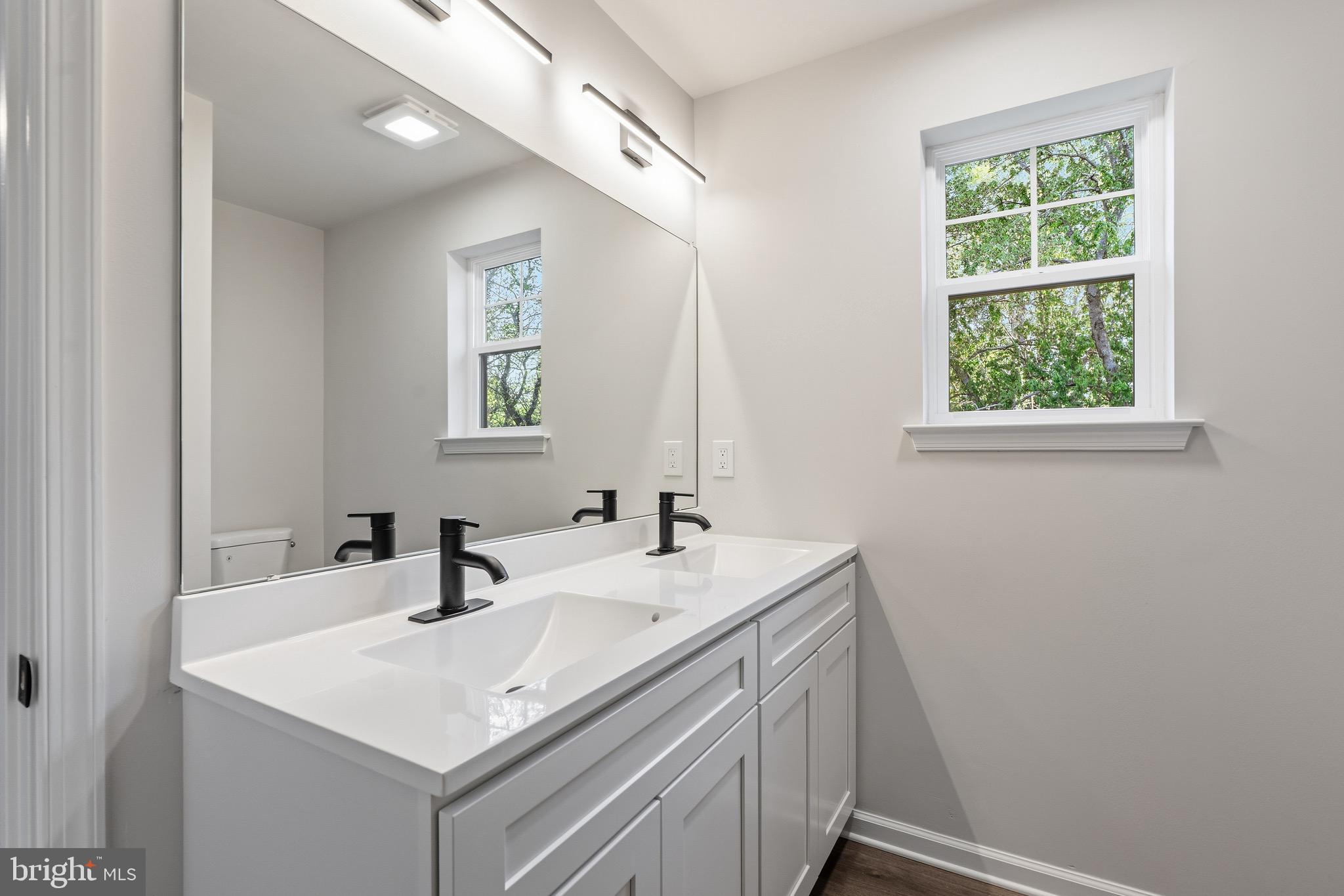 212 Lotus Avenue Voorhees, NJ 08043 - Photo 30 of 39 a bathroom with a sink and a vanity