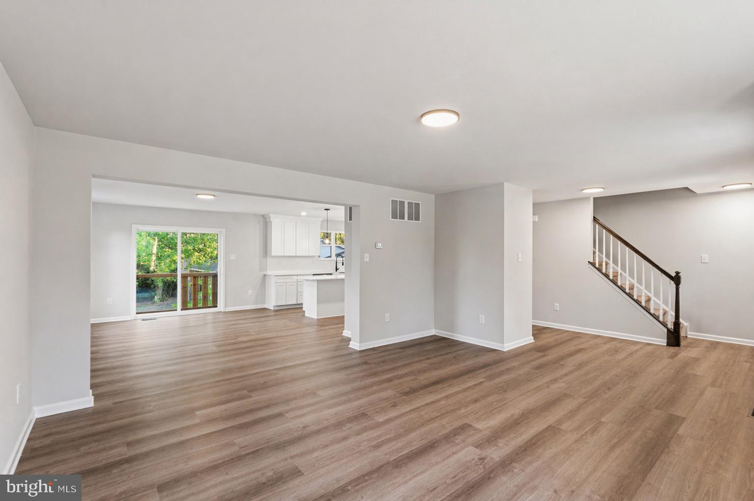 212 Lotus Avenue Voorhees, NJ 08043 - Photo 5 of 39 a view of empty room with wooden floor and window