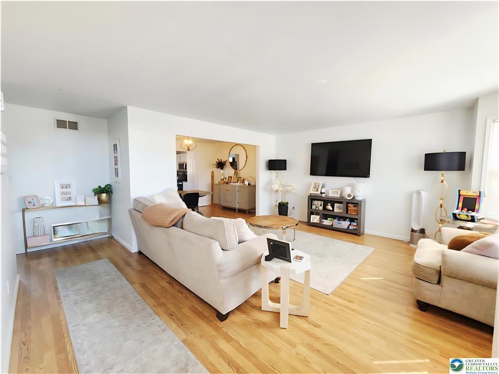 237 Ridings Circle Macungie, PA 18062 - Photo 15 of 70 Polished hardwood floors anchor this inviting, open living space illuminated by natural light.