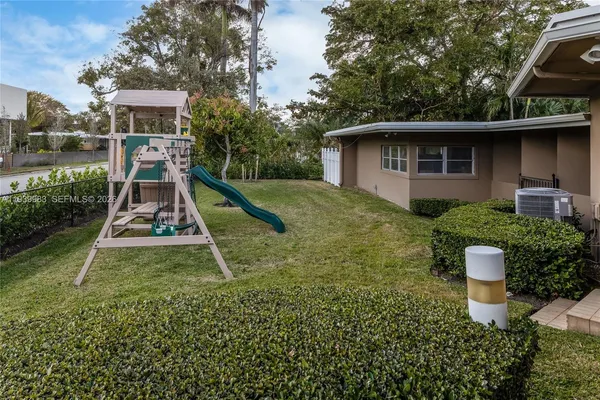 a view of swimming pool with outdoor seating