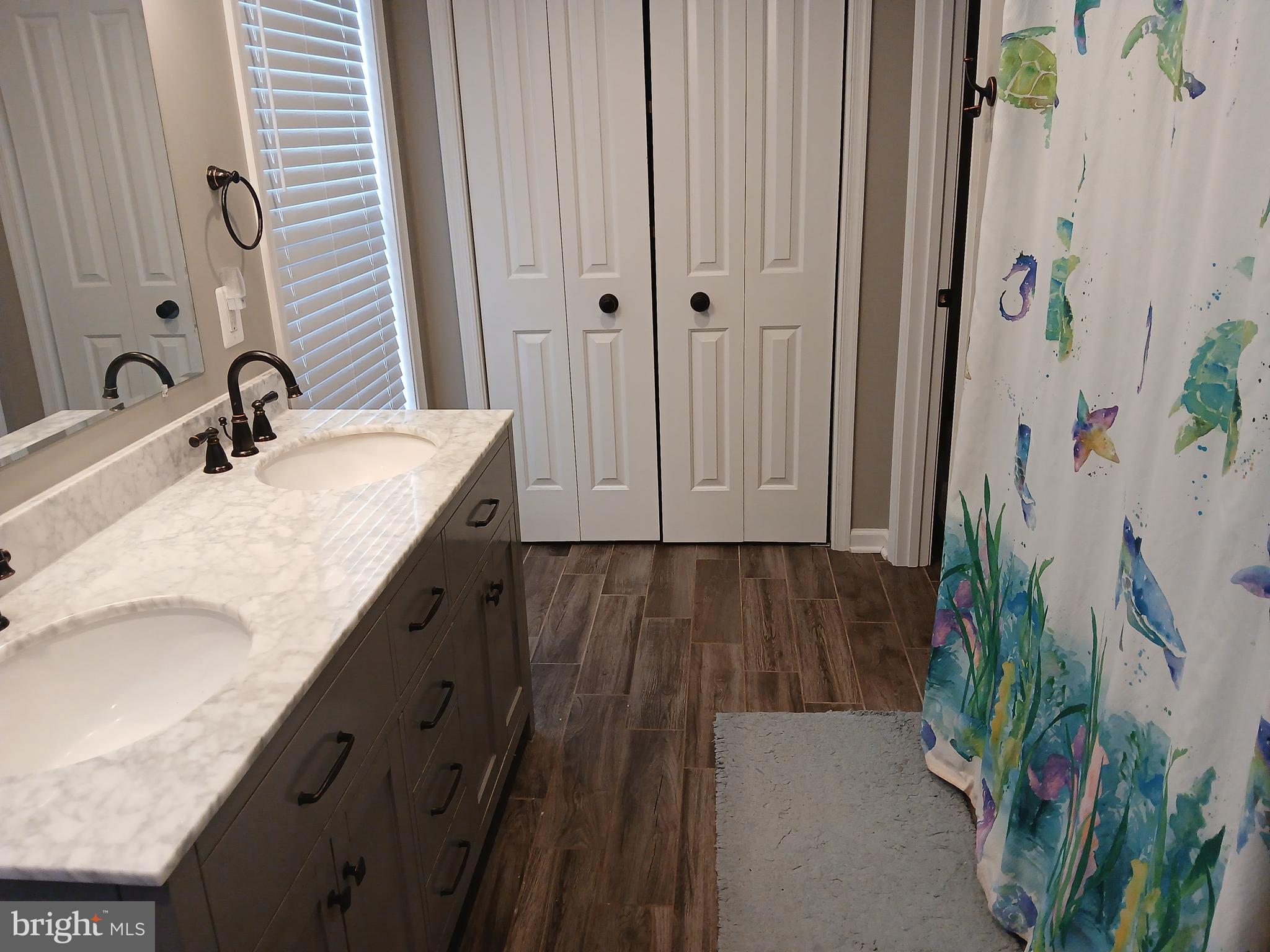 11337 Russell Road Purcellville, VA 20132 - Photo 15 of 18 a bathroom with a granite countertop sink and a mirror