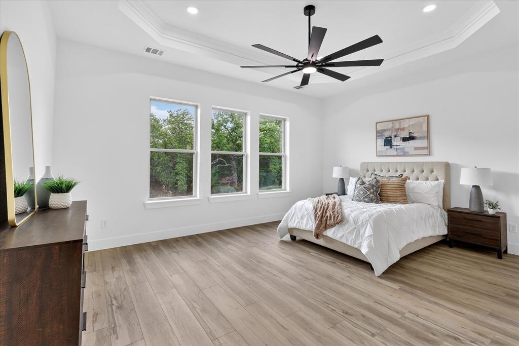 182 Briar Patch Azle, TX 76020 - Photo 16 of 36 Bedroom featuring light wood-style flooring and ceiling fan