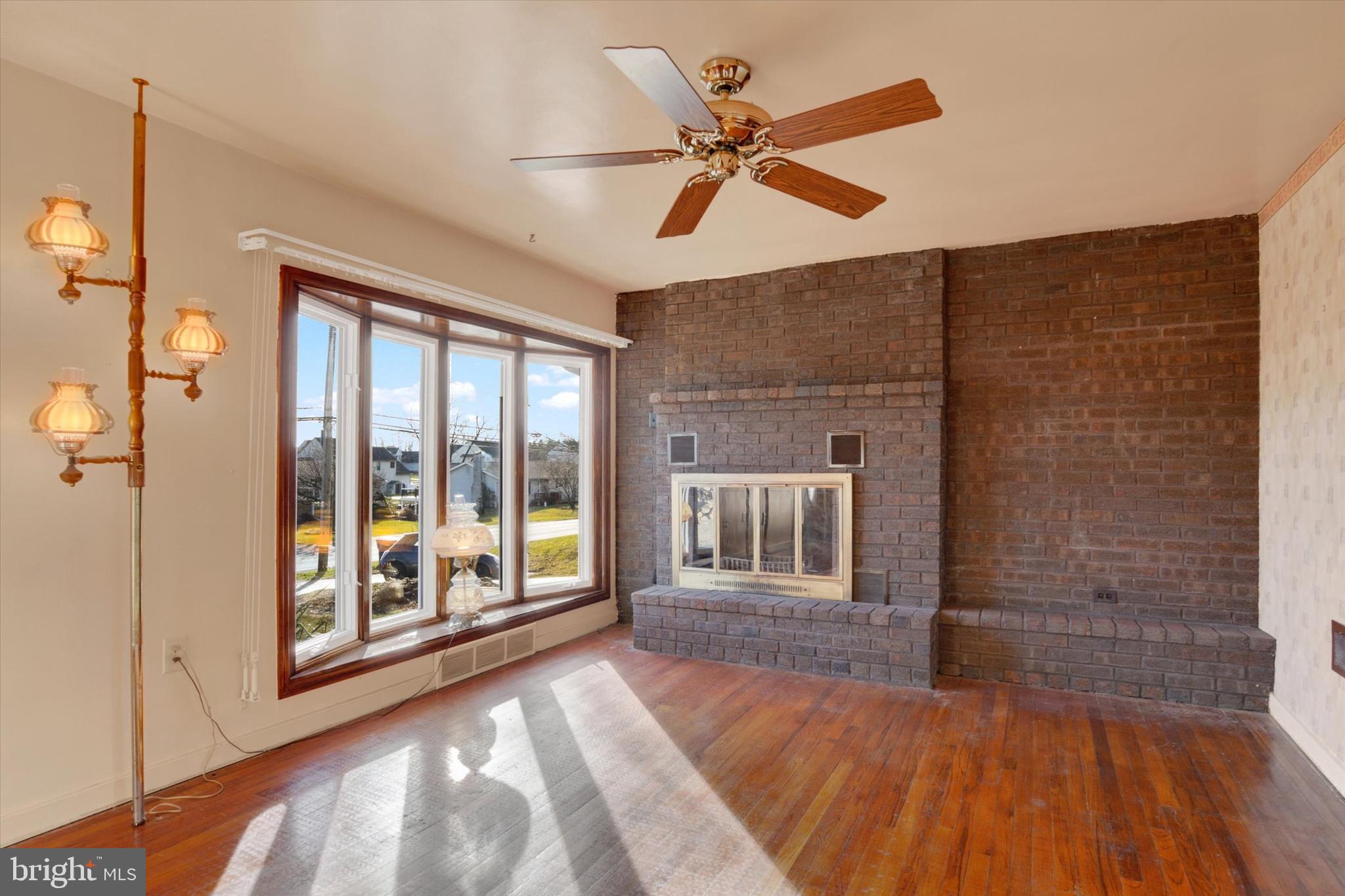 5924 Devonshire Heights Road Harrisburg, PA 17112 - Photo 5 of 33 a bedroom with a large bed and a chandelier