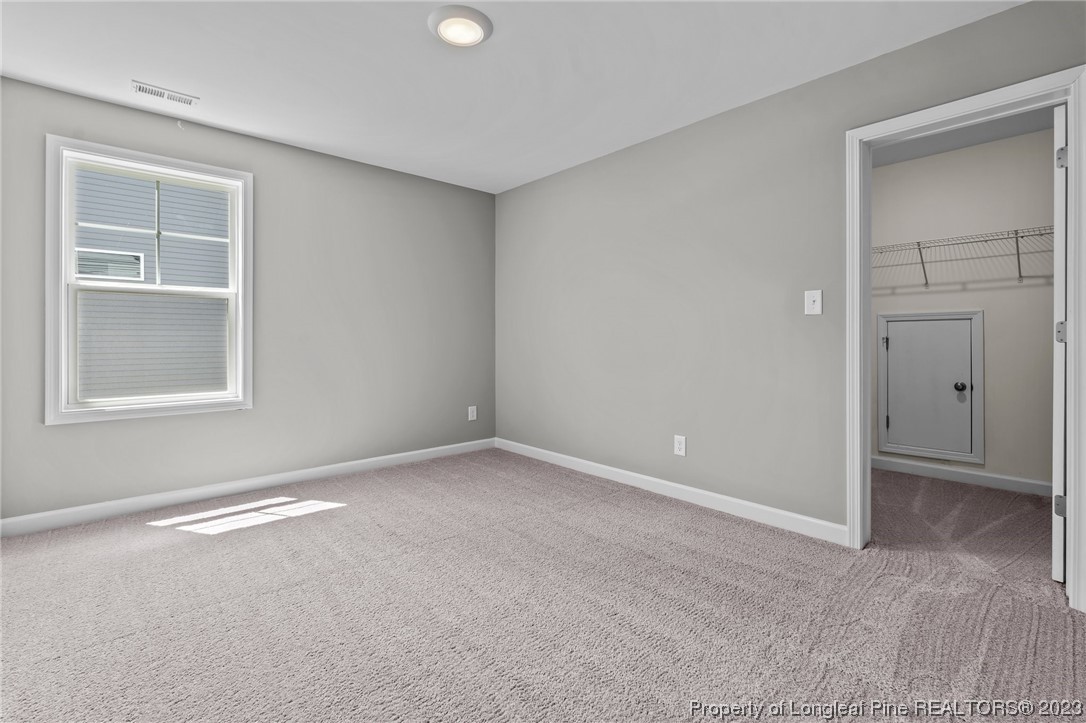 41 Timber Hill Crossing Spring Lake Spring Lake, NC 28390 - Photo 11 of 16 an empty room with windows and closet