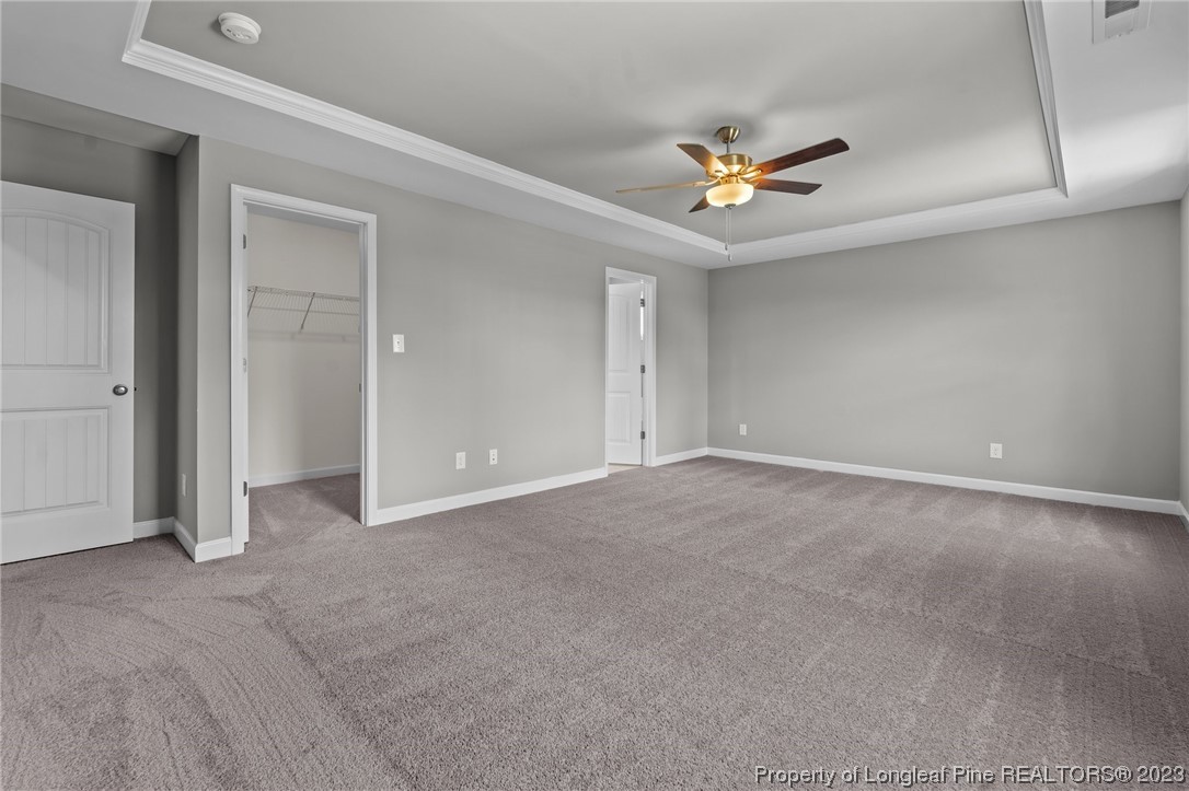 41 Timber Hill Crossing Spring Lake Spring Lake, NC 28390 - Photo 6 of 16 an empty room with closet and a chandelier fan