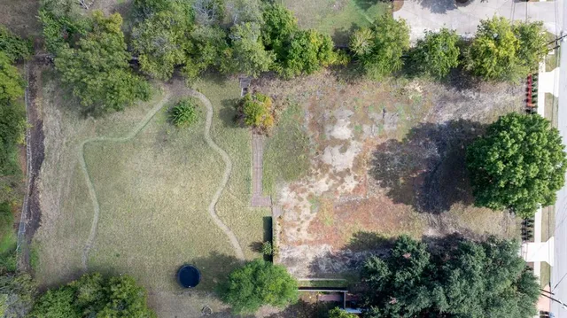 a view of a city street and trees