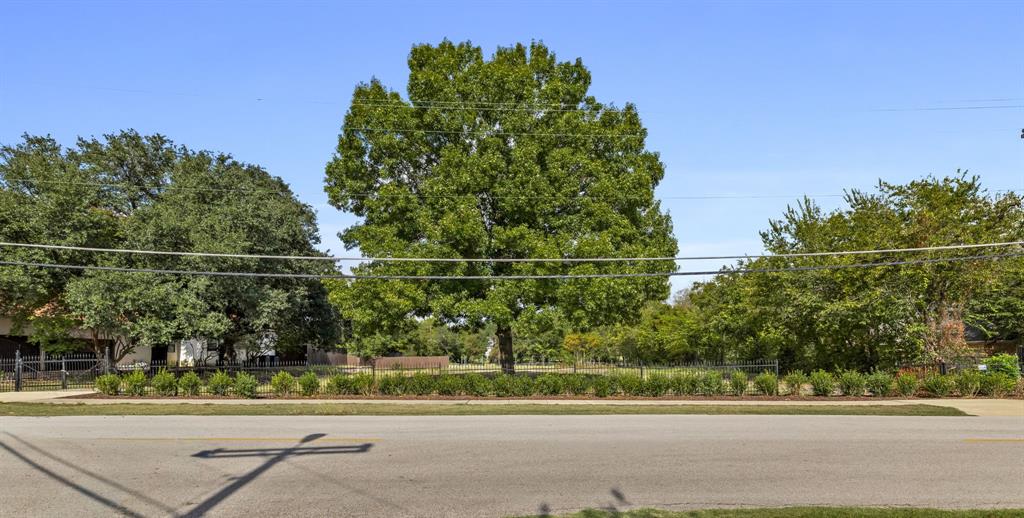 6639 Willow Lane Dallas, TX 75230 - Photo 3 of 14 a view of a city street and trees