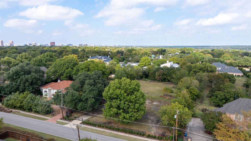 6639 Willow Lane Dallas, TX 75230 - Photo 4 of 14 a view of a city with flower garden