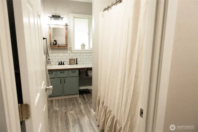 a room with a sink and a mirror