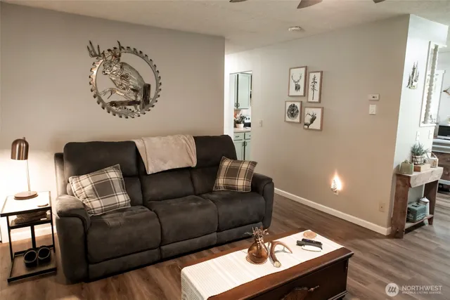a living room with furniture and a lamp