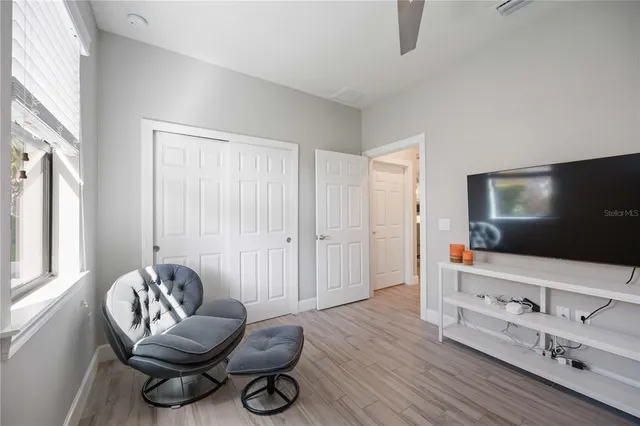 a view of a lake with houses in the back